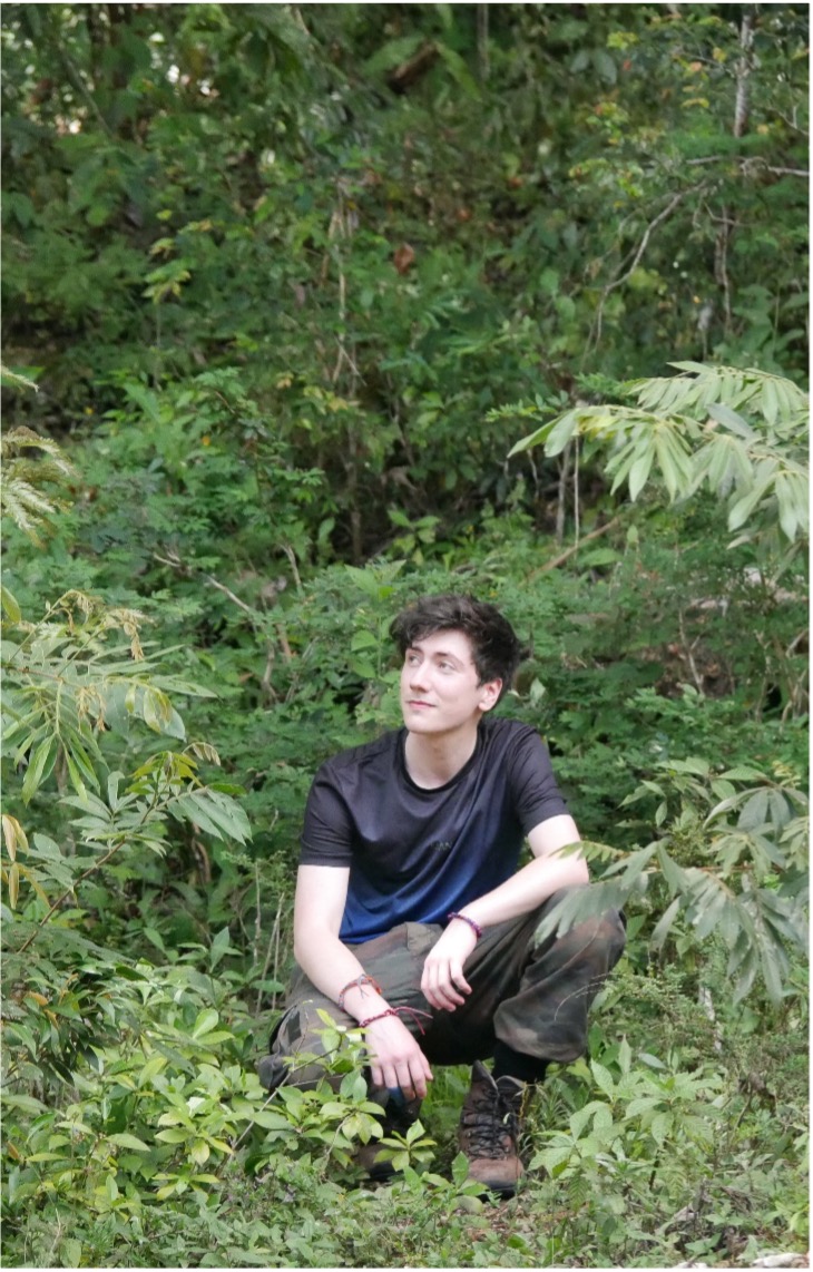 A photo of Matthew in the field.