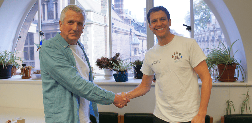 Dr William Foster and Prof Tim Weil shake hands during the Zoology Alumni and Friends Open Day