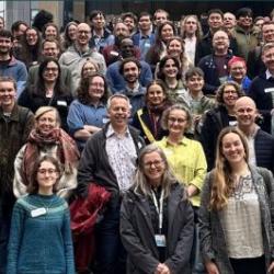 Attendees at the 2025 Bumblebee Working Group stand on the steps of the Zoology Museum in Cambridge for a group photo.