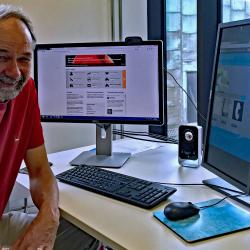 Prof Bill Sutherland working in his office