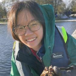 Third year student, Jia Rong Poon and naked clams in a piece of wood 