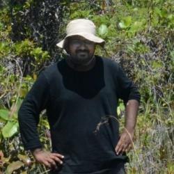 Ritabrata Chowdhury in scrub land in Brunei