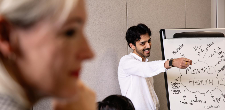 University Student Wellbeing Counsellor talking to students at the Student Services Centre. Copyright: University of Cambridge (November 2024)