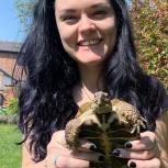 Lucy Roberts holding a tortoise